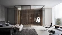 Spazio glass partition wall system with Sail interior sliding glass doors.