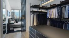 Victory Park High-Rise: Walk-in closet using Rimadesio Dress Bold and Self with Rimadesio Sail sliding glass door as partition from master bedroom.