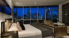 Master bedroom at dusk with view of downtown Dallas.