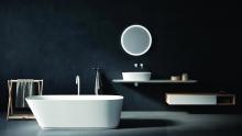 Ell with over countertop Bjhon 1 washbasin, Lato storage unit, Neb bathtub, Fez taps and an illuminated Memory mirror.