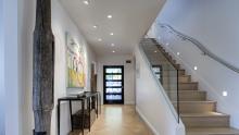 Entrance foyer with staircase leading to second floor.