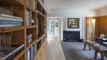 Library with refurbished original wood shelving.