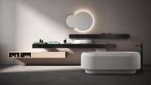 Agape: Lariana bathtub with Flat XL Programme using a Lariana vessel washbasin. Lato cabinets, Sen accessories, and an illuminated Eclissi mirror complete the setup.