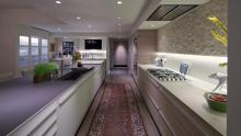 Oakview Estates: View looking across kitchen towards wet bar showing glass countertop on island.