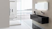 Toscoquattro: Stone wall-hung washbasin in the Time collection paired with a Concerto shower.
