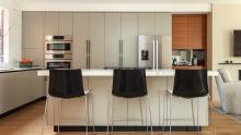 Pohlenz cabinetry in matte lacquer and walnut with quartz countertops