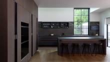 A view of the open aerius cabinet above the cooktop.